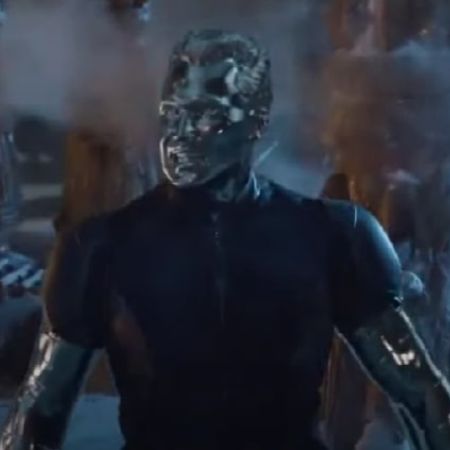 Colossus is standing still as destruction is happening around him.